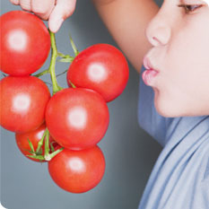 boy and fresh vegetables photo